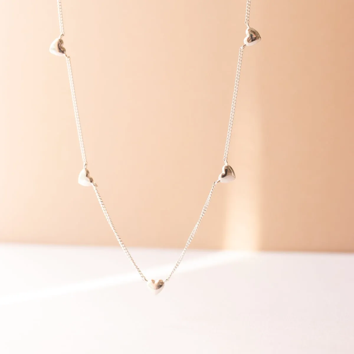 DAINTY POISE HEART NECKLACE - SILVER